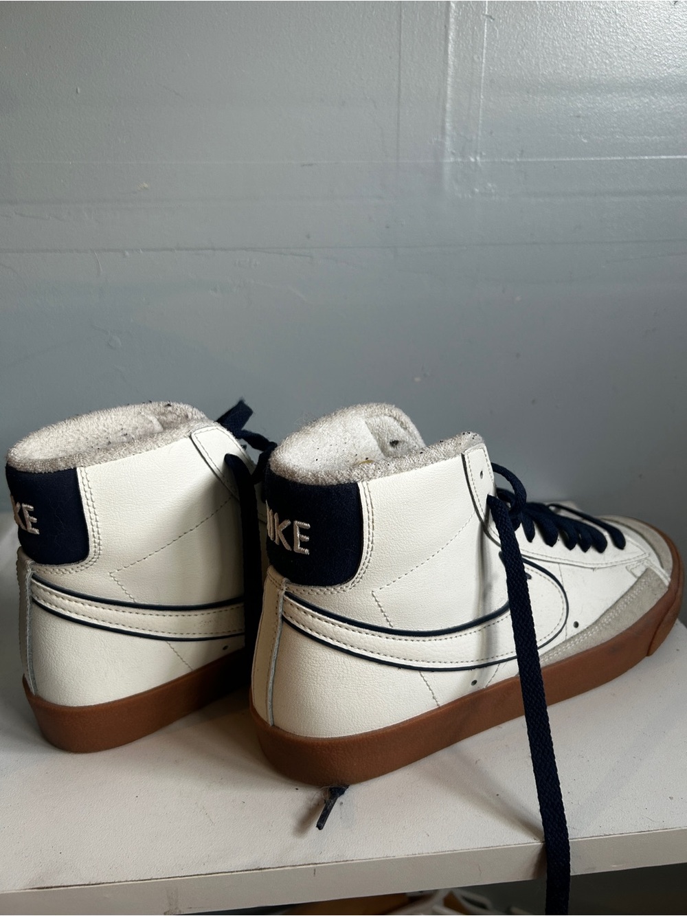 Nike Kids White High-Top Sneakers with Navy Accents and Brown Gum Sole